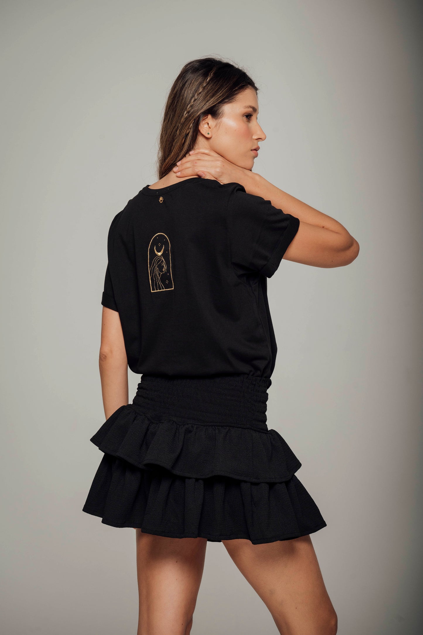 Falda negra con boleros en tela polyester y pretina elástica Salar