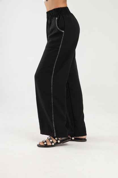 Pantalón negro, silueta recta con pretina elástica Marea