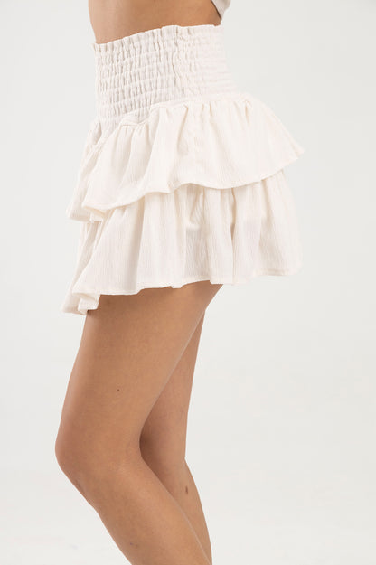 Falda blanca con boleros en tela polyester y pretina elástica Salar