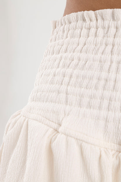 Falda blanca con boleros en tela polyester y pretina elástica Salar
