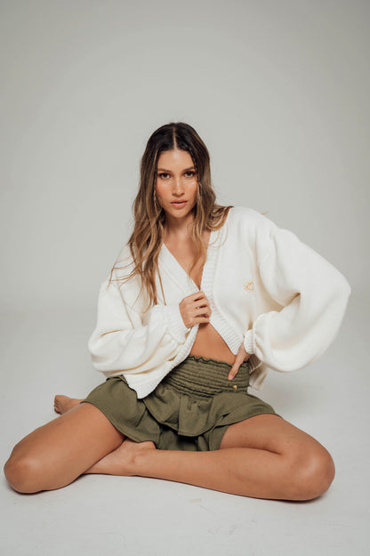 Falda verde militar con boleros en tela polyester y pretina elástica  Salar