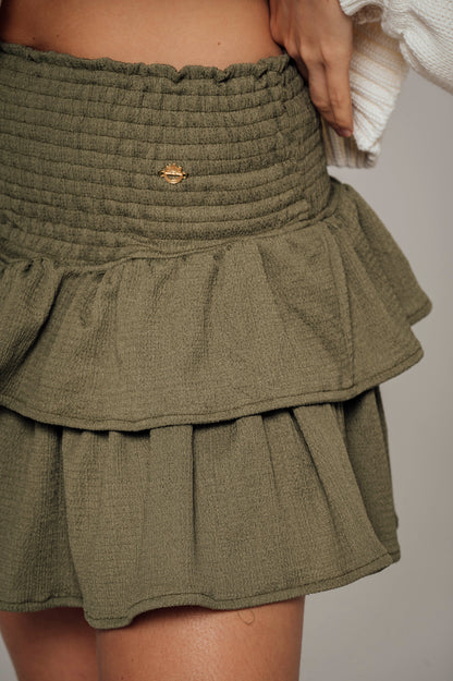 Falda verde militar con boleros en tela polyester y pretina elástica  Salar
