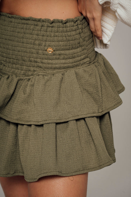 Falda verde militar con boleros en tela polyester y pretina elástica  Salar